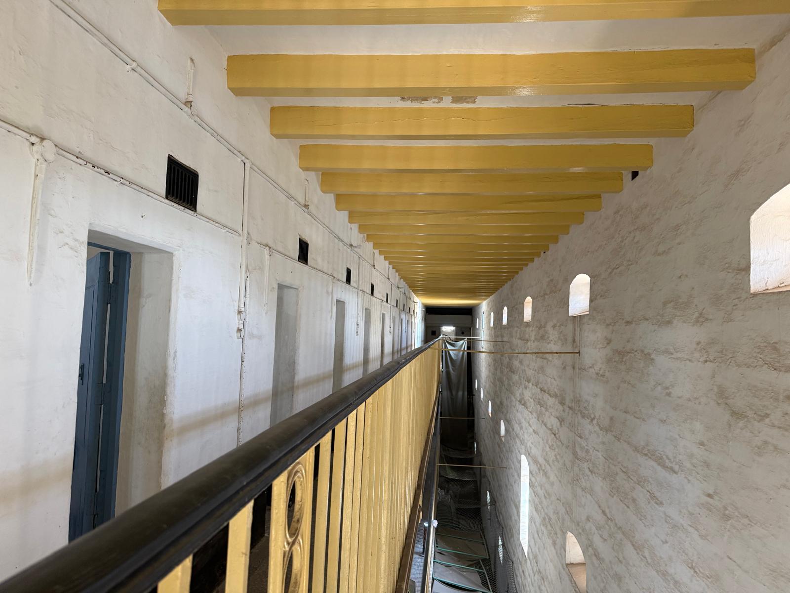 Long corridor with yellow ceiling